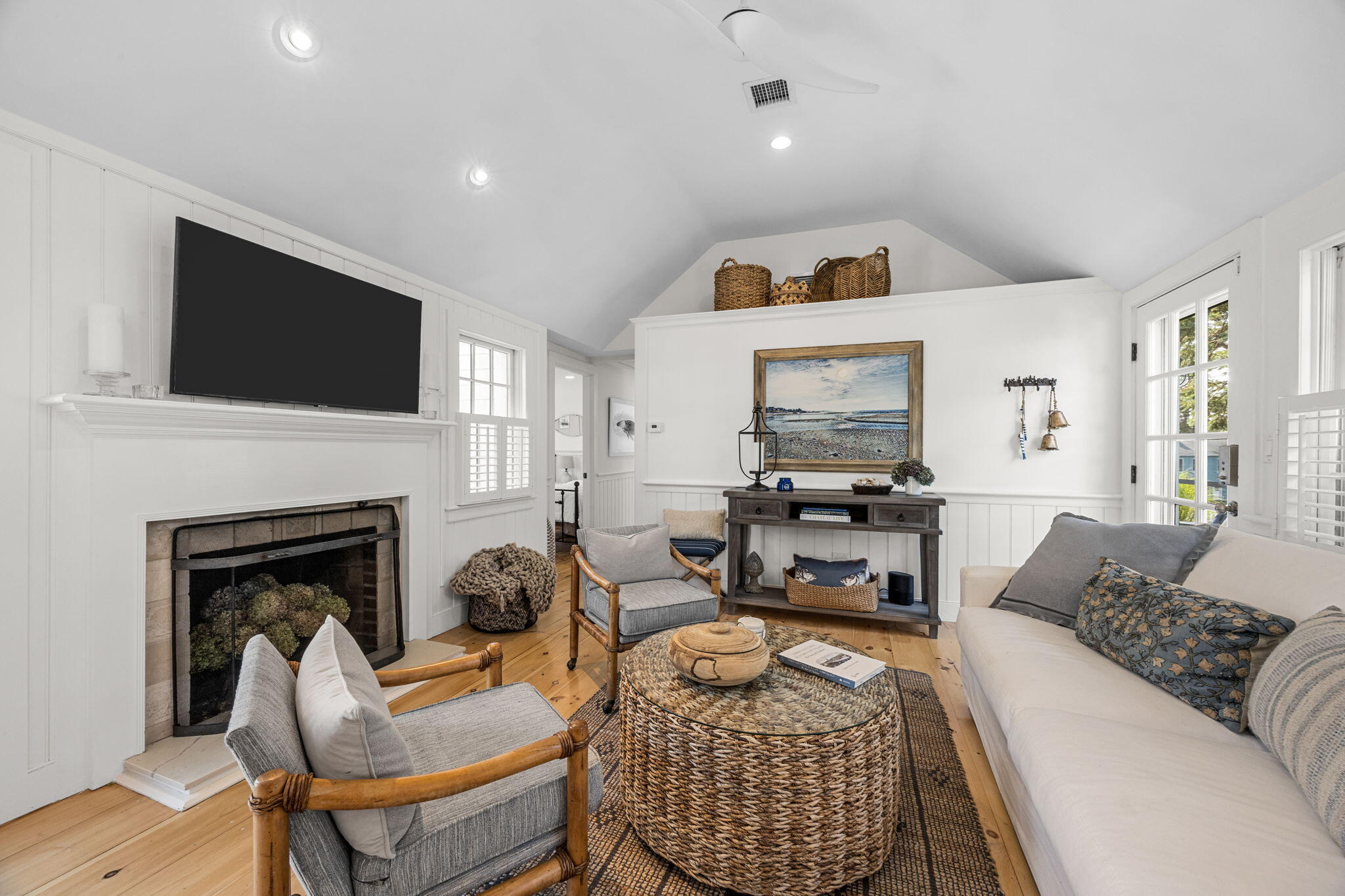 291 Ridgevale Road Chatham, MA 02633 - Photo 24 of 53 a living room with furniture a fireplace and a flat screen tv