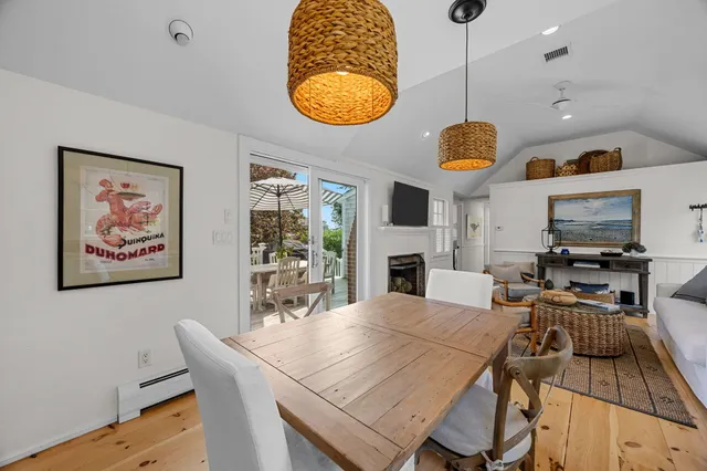a kitchen with stainless steel appliances granite countertop white cabinets a stove a sink and dishwasher