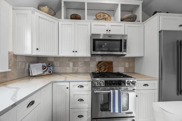 a view of hallway with wooden floor