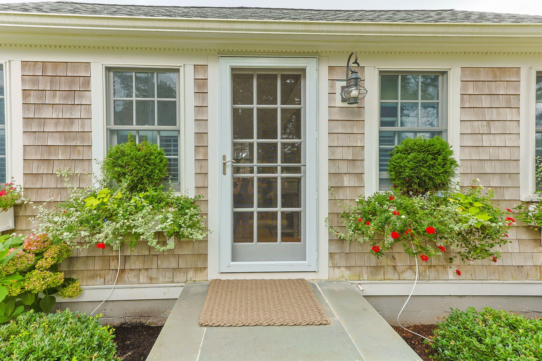 291 Ridgevale Road Chatham, MA 02633 - Photo 7 of 53 a house with a potted plant in front of it
