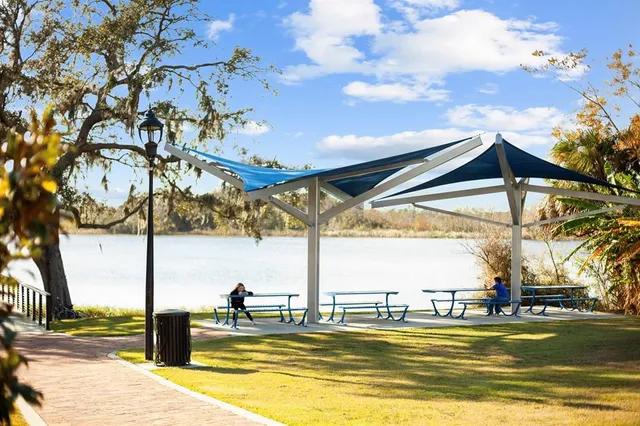 a swimming pool with some trees in the background
