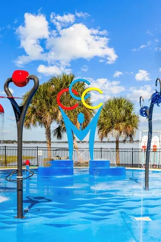 a view of swimming pool with outdoor seating