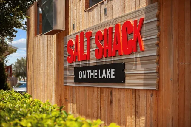 a view of a dinning table and chairs in the balcony