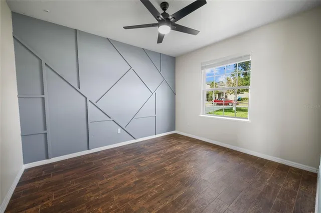 a view of an empty room with a window
