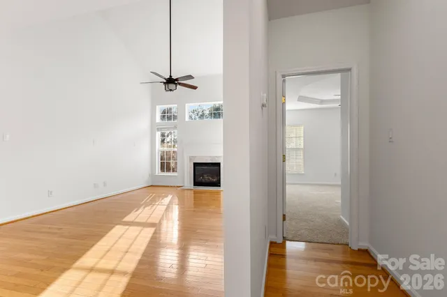 a view of an empty room with a fireplace