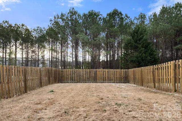 a front view of a house with parking space