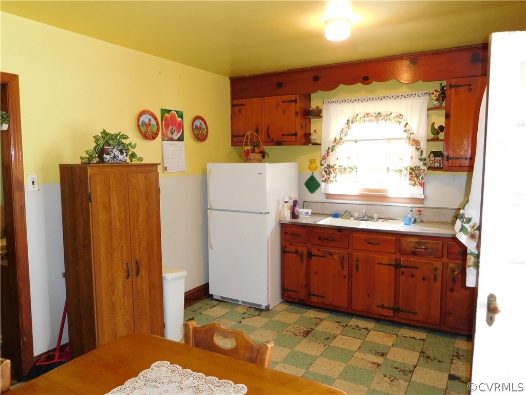 11824 Ivey Mill Road Chesterfield, VA 23838 - Photo 6 of 17 a kitchen with a refrigerator and a cabinets