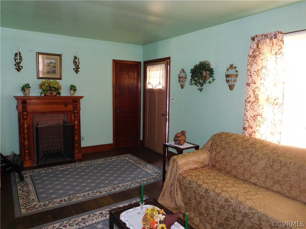 11824 Ivey Mill Road Chesterfield, VA 23838 - Photo 7 of 17 a bedroom with a bed and a fireplace