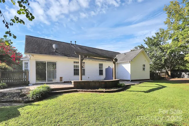 a front view of a house with a yard and porch