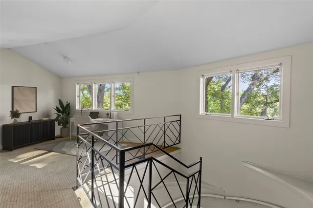 a view of a livingroom with furniture and windows