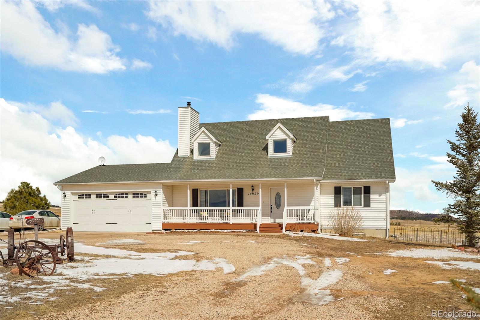 14929 South Spring Valley Road Larkspur, CO 80118 - Photo 1 of 40 a view of a house with a patio