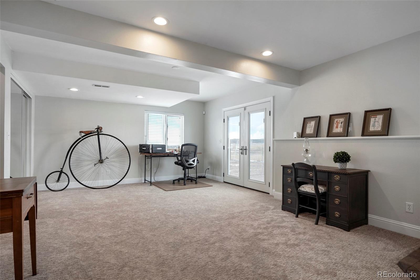 14929 South Spring Valley Road Larkspur, CO 80118 - Photo 25 of 40 a living room with furniture a table and window