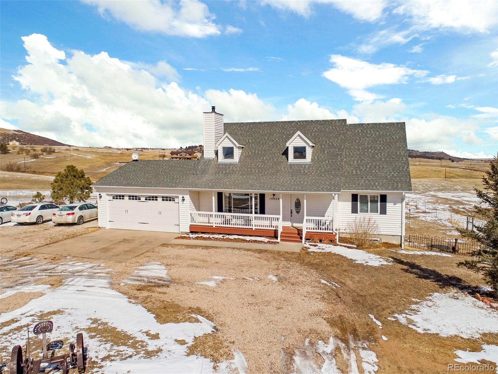 14929 South Spring Valley Road Larkspur, CO 80118 - Photo 35 of 40 a view of a house with a outdoor space