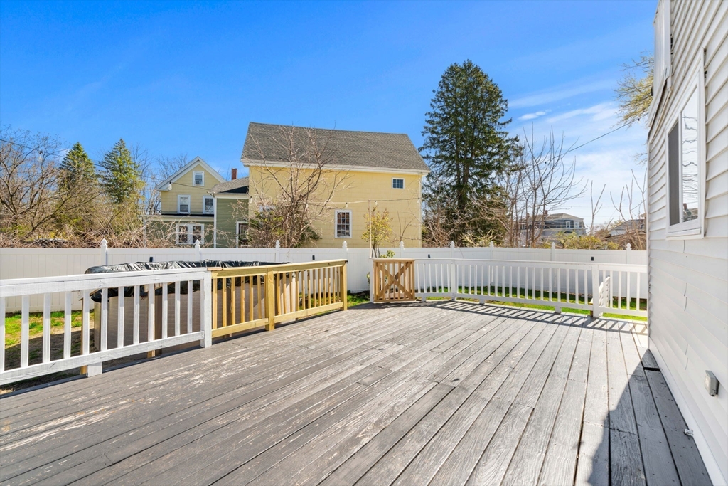 271 Broadway Haverhill, MA 01832 - Photo 34 of 41 a view of a balcony with wooden floor and fence