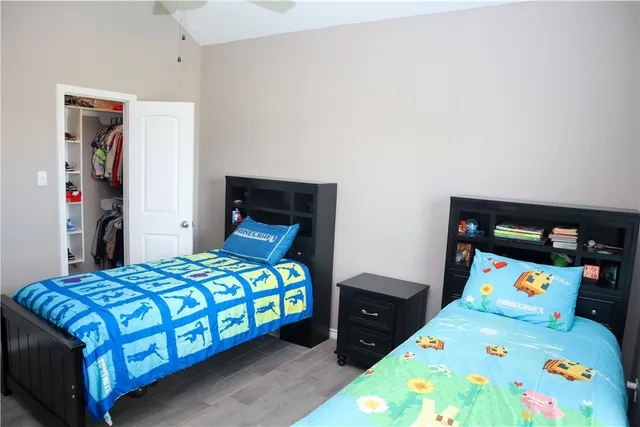 a bedroom with a bed and a baby crib