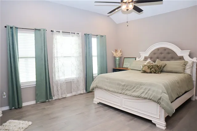 a bedroom with a bed and window