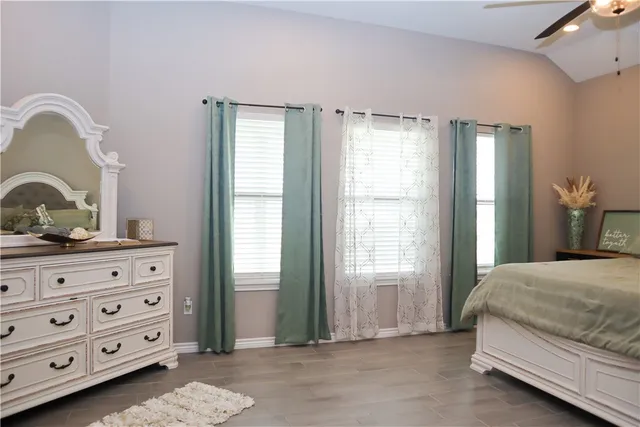 a bedroom with a bed and a dresser