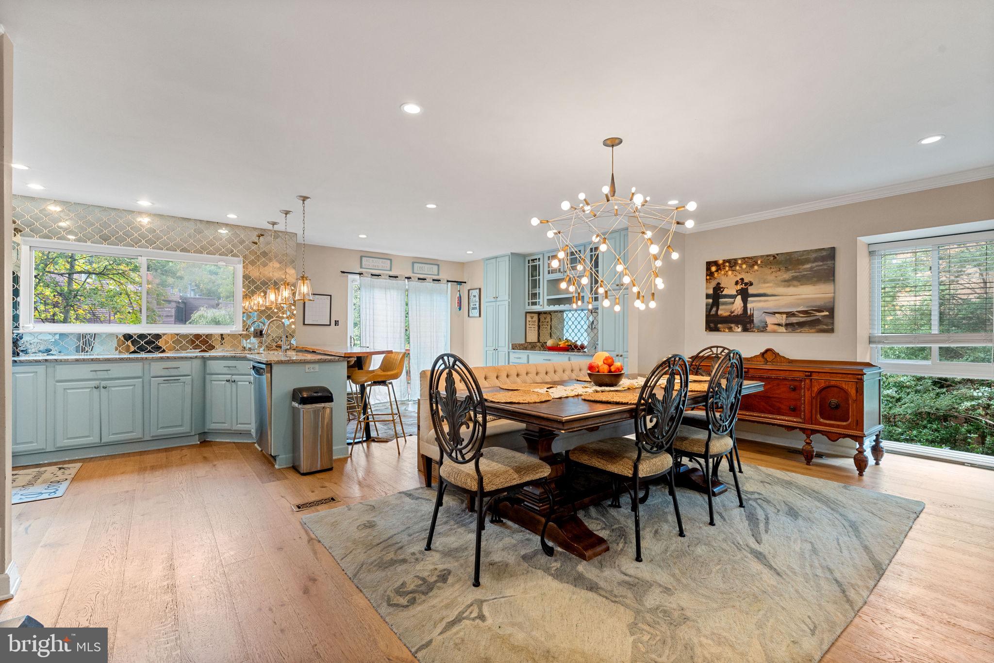 2012 Swans Neck Way Reston, VA 20191 - Photo 1 of 36 a kitchen with a table chairs sink and cabinets