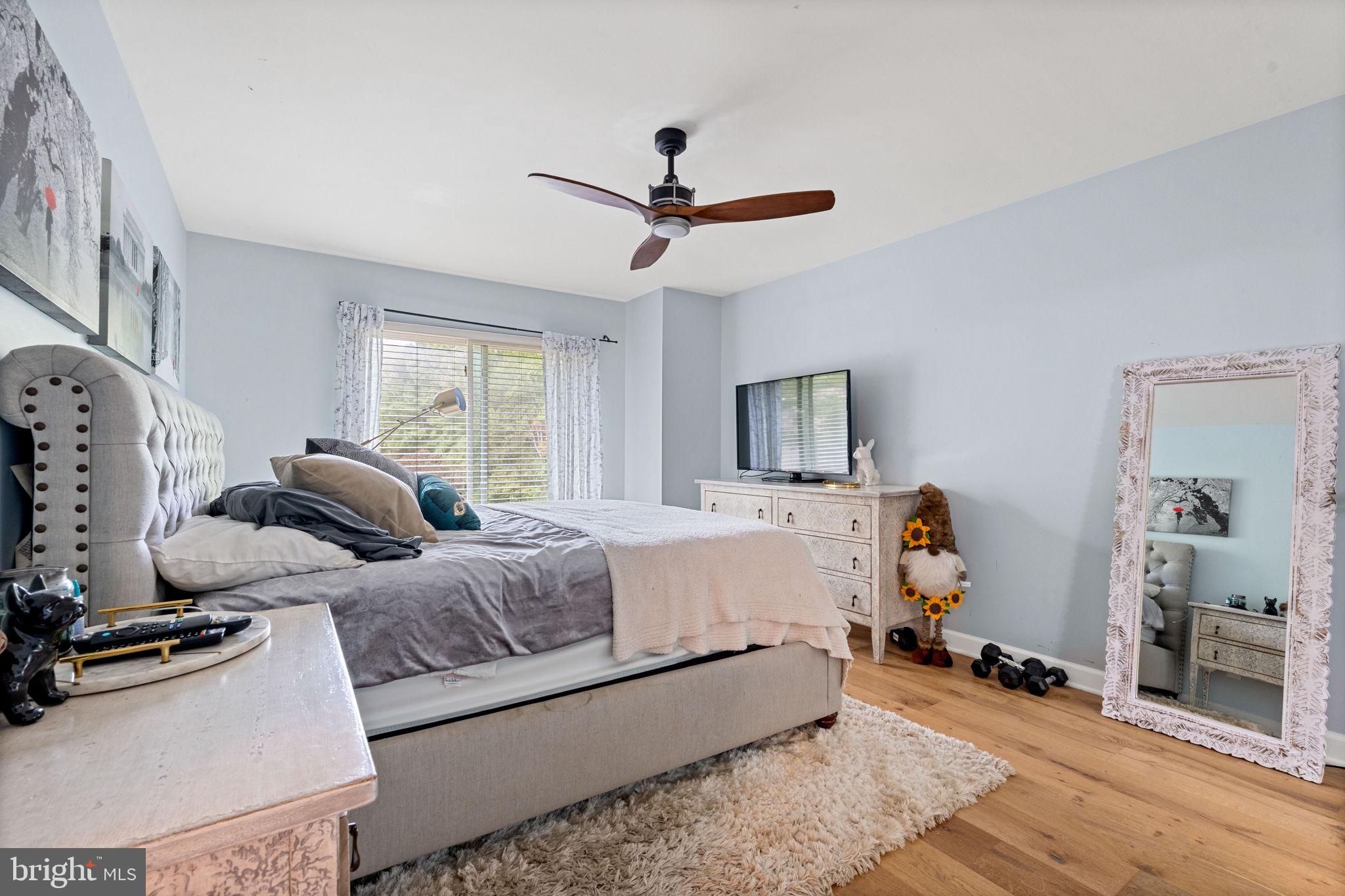 2012 Swans Neck Way Reston, VA 20191 - Photo 16 of 36 a living room with bed furniture and a window