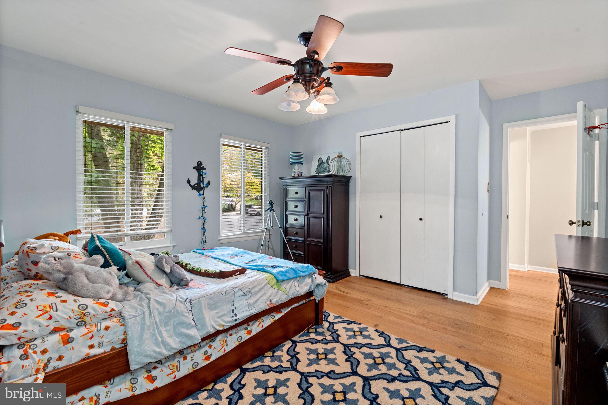 2012 Swans Neck Way Reston, VA 20191 - Photo 20 of 36 a bedroom with a bed and a chandelier