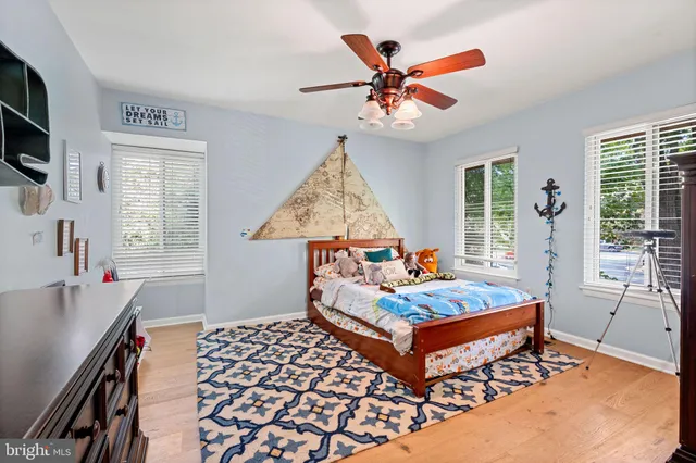 a living room with furniture and flat screen tv