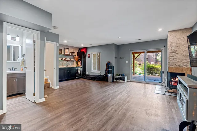 a view of a livingroom with furniture and a flat screen tv