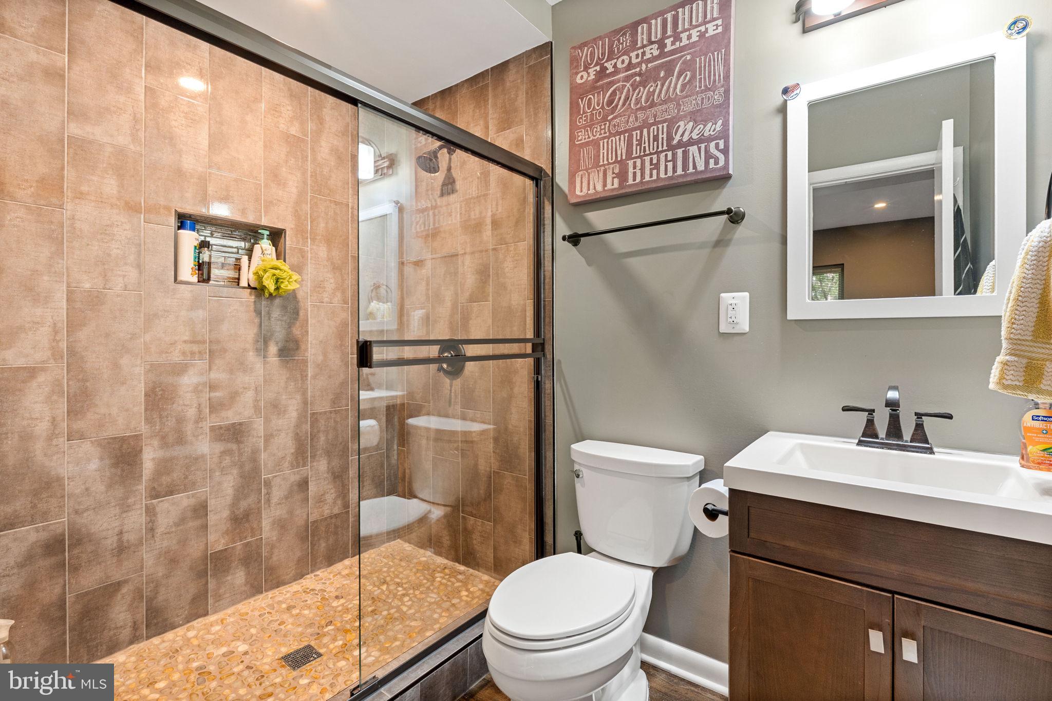 2012 Swans Neck Way Reston, VA 20191 - Photo 29 of 36 a bathroom with a sink a toilet and shower