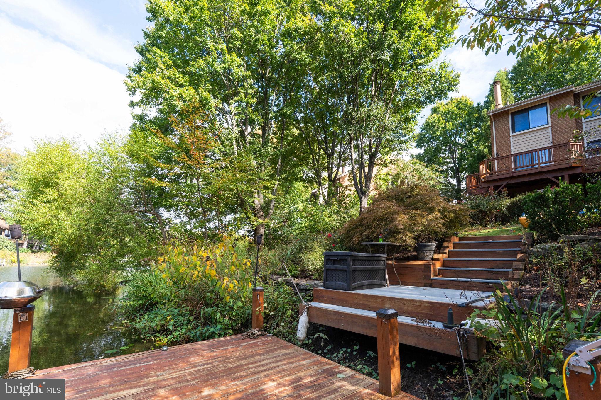 2012 Swans Neck Way Reston, VA 20191 - Photo 31 of 36 a view of a bench in a backyard