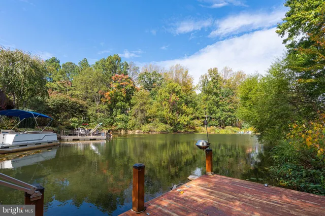 a view of a lake with a house in the background