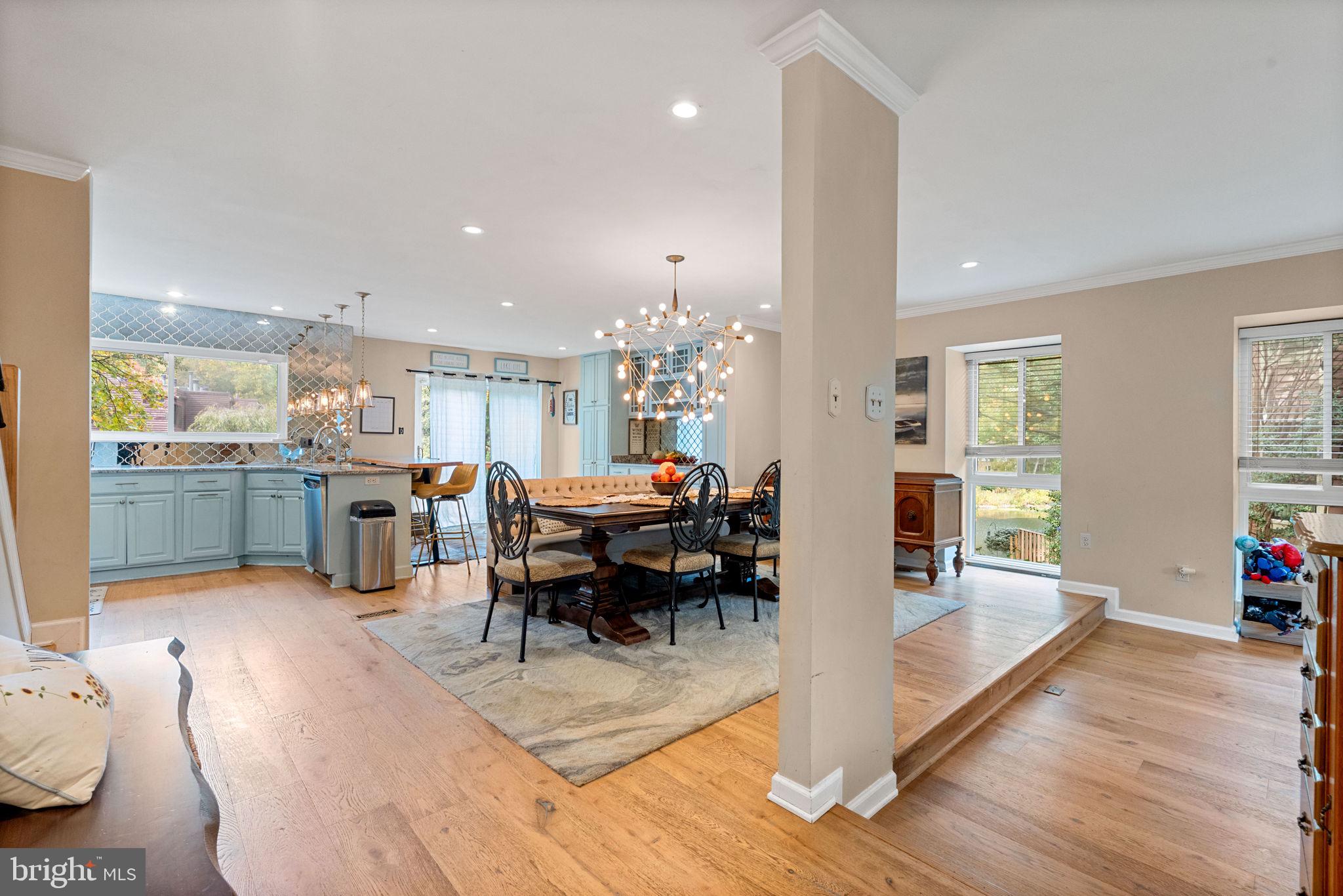 2012 Swans Neck Way Reston, VA 20191 - Photo 9 of 36 a living room with lots of furniture and kitchen view