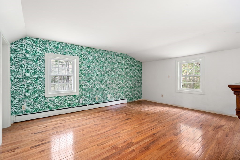 47 Stonebrook Road Sudbury, MA 01776 - Photo 11 of 17 a view of an empty room with wooden floor and a window