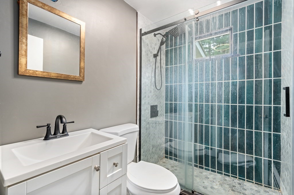 47 Stonebrook Road Sudbury, MA 01776 - Photo 14 of 17 a bathroom with a sink toilet and shower