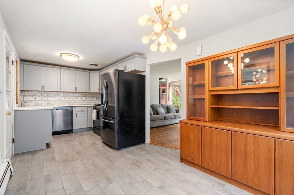 47 Stonebrook Road Sudbury, MA 01776 - Photo 7 of 17 a kitchen with stainless steel appliances a refrigerator and cabinets