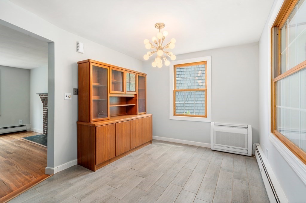 47 Stonebrook Road Sudbury, MA 01776 - Photo 8 of 17 wooden floor in an empty room with a window