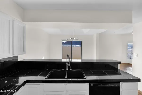 a kitchen with a sink and cabinets