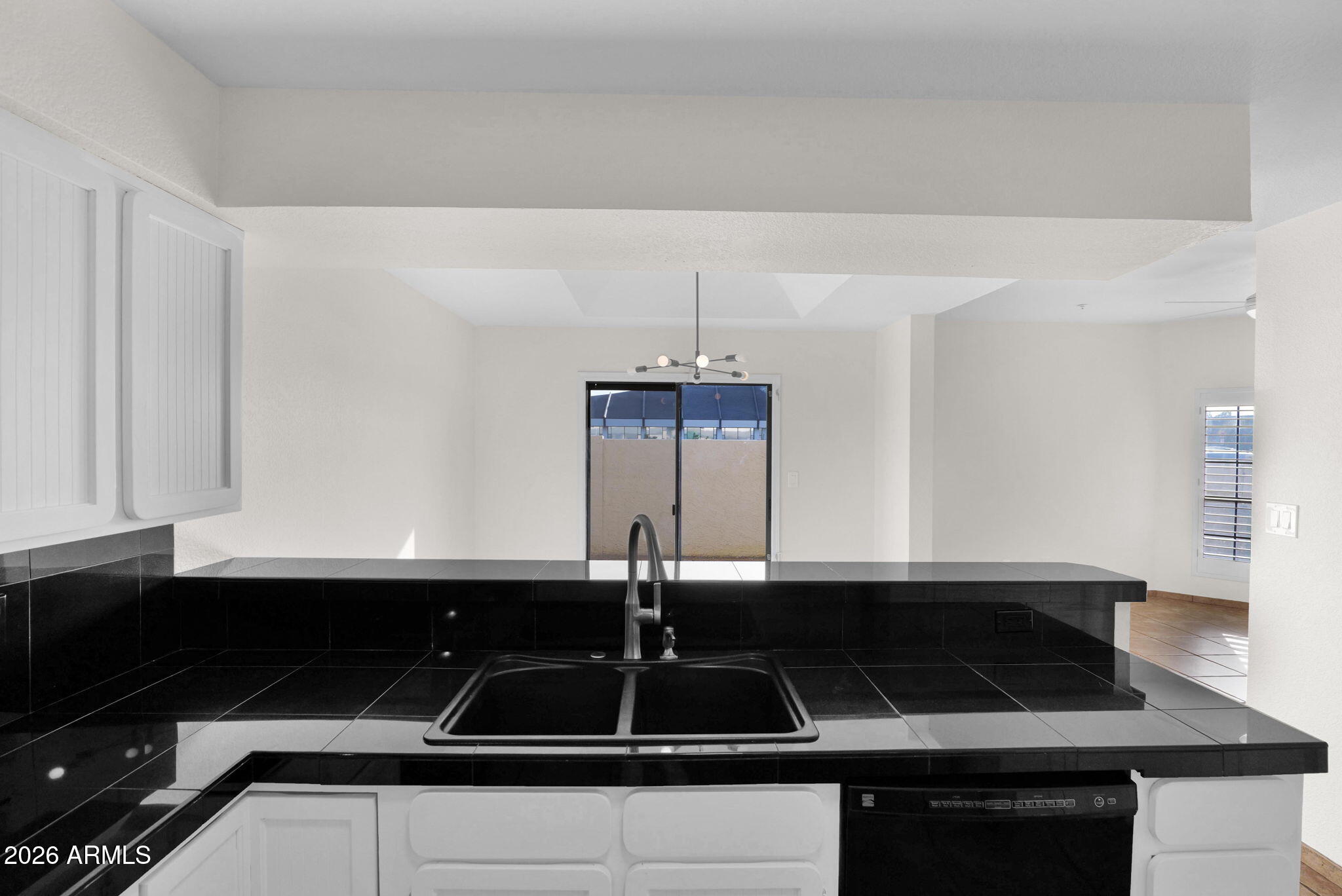 1124 East Rose Lane, Unit 3 Phoenix, AZ 85014 - Photo 13 of 37 a kitchen with a sink and cabinets