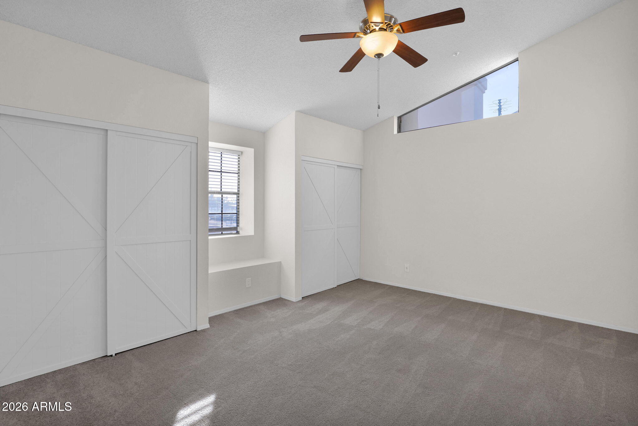 1124 East Rose Lane, Unit 3 Phoenix, AZ 85014 - Photo 17 of 37 a view of an empty room with a window