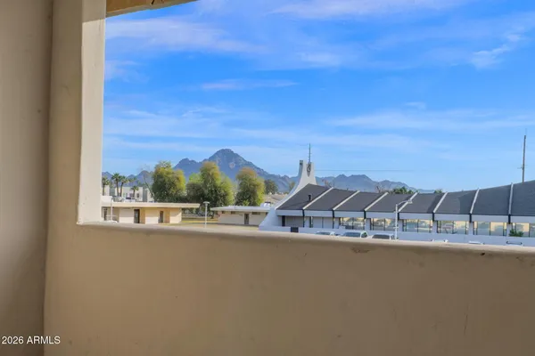 a view of a balcony with ocean view