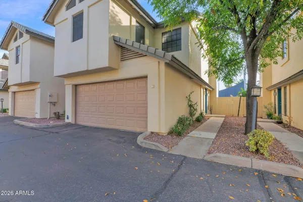 a view of a house with a street