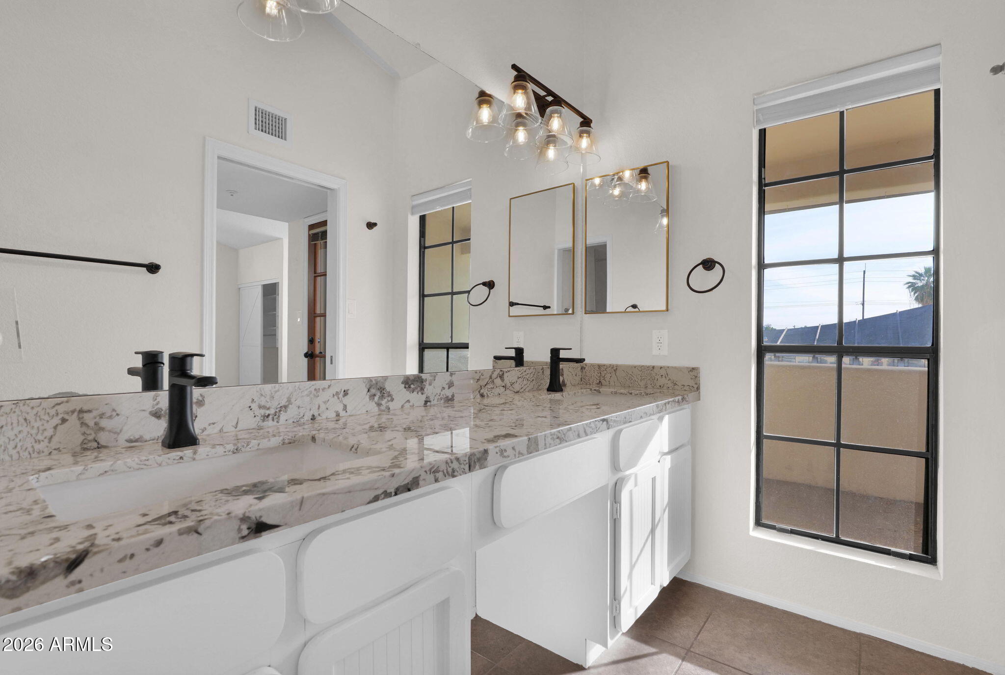 1124 East Rose Lane, Unit 3 Phoenix, AZ 85014 - Photo 22 of 37 a bathroom with a granite countertop sink mirror and shower