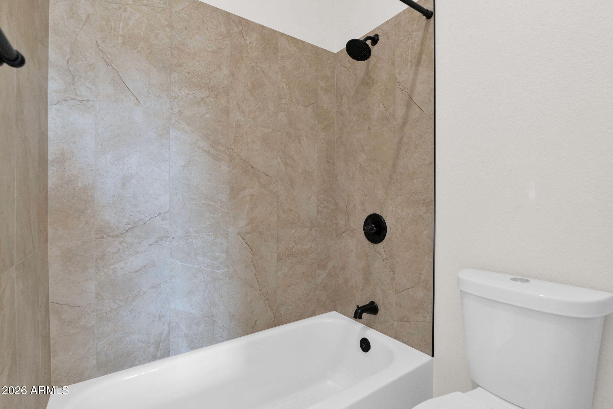 1124 East Rose Lane, Unit 3 Phoenix, AZ 85014 - Photo 23 of 37 a bathroom with a bathtub
