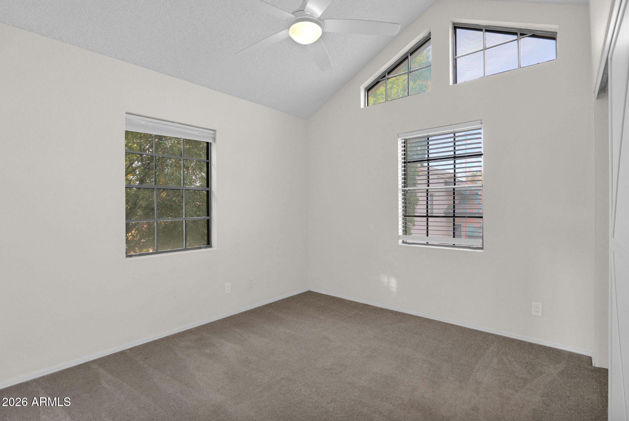 1124 East Rose Lane, Unit 3 Phoenix, AZ 85014 - Photo 24 of 37 an empty room with windows