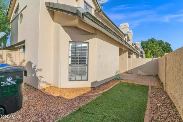 a view of a house with a backyard