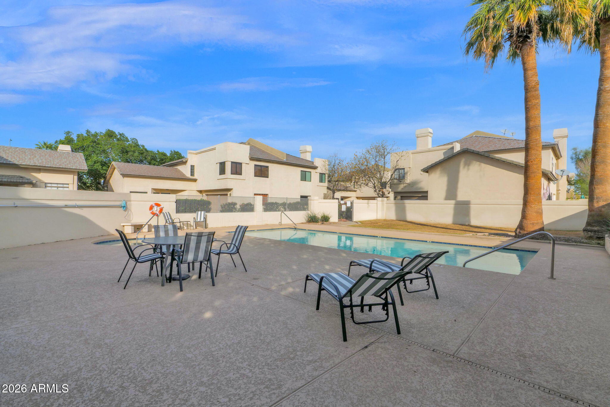 1124 East Rose Lane, Unit 3 Phoenix, AZ 85014 - Photo 34 of 37 a view of a patio with a table and chairs