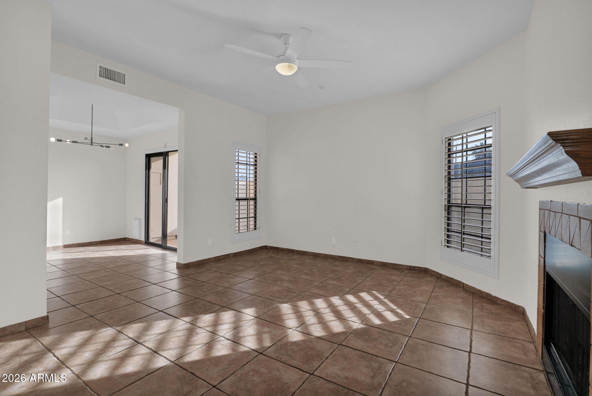 1124 East Rose Lane, Unit 3 Phoenix, AZ 85014 - Photo 4 of 37 a view of an empty room with a fireplace