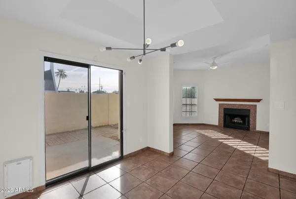 a view of an empty room with glass door