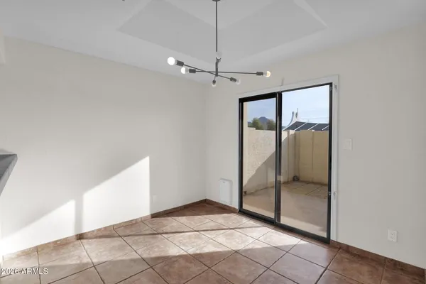 a view of an empty room with glass door