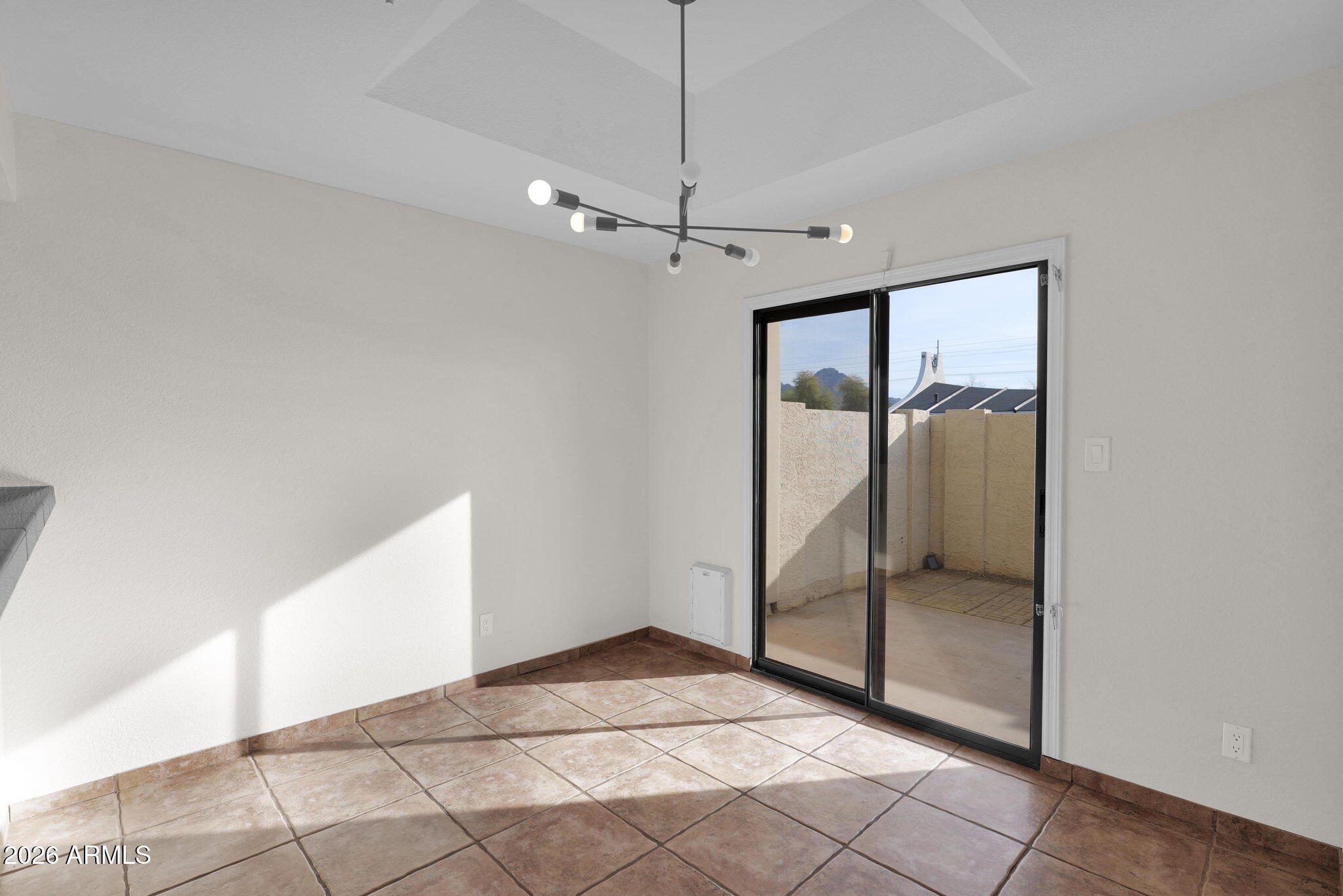 1124 East Rose Lane, Unit 3 Phoenix, AZ 85014 - Photo 7 of 37 a view of an empty room with glass door