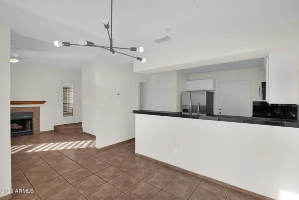 a view of a kitchen with a sink and a stove top oven