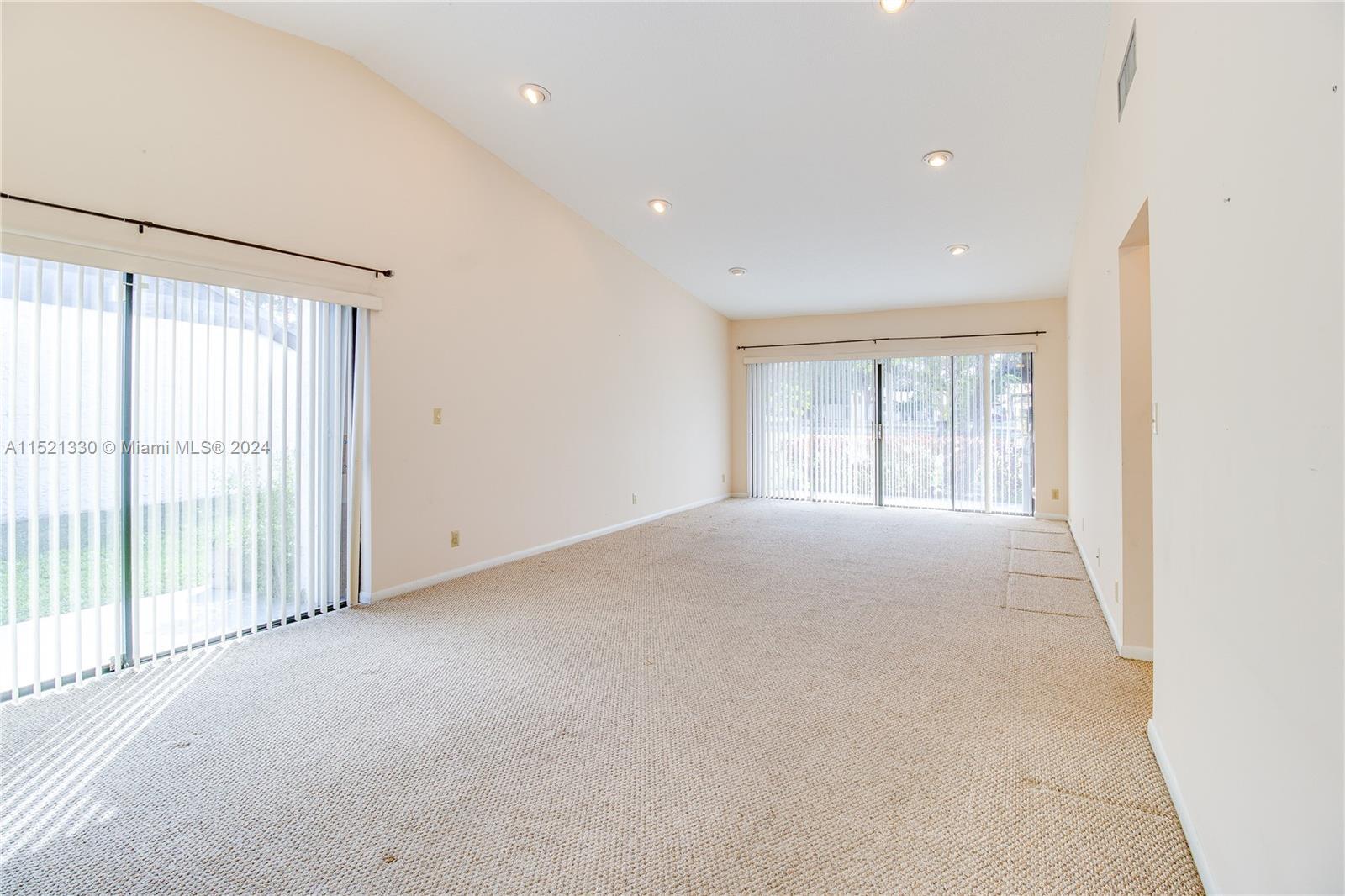 6343 Pinehurst Circle, Unit D36 Tamarac, FL 33321 - Photo 6 of 13 a view of an empty room with a window
